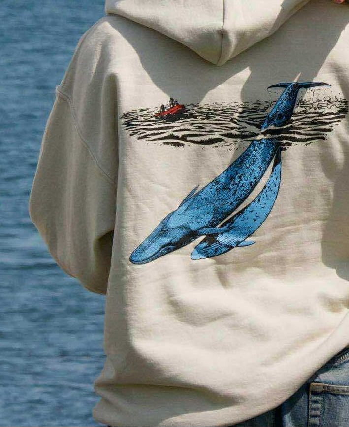 Unisex Whale Explorer Hoodie with bold whale graphic on back.